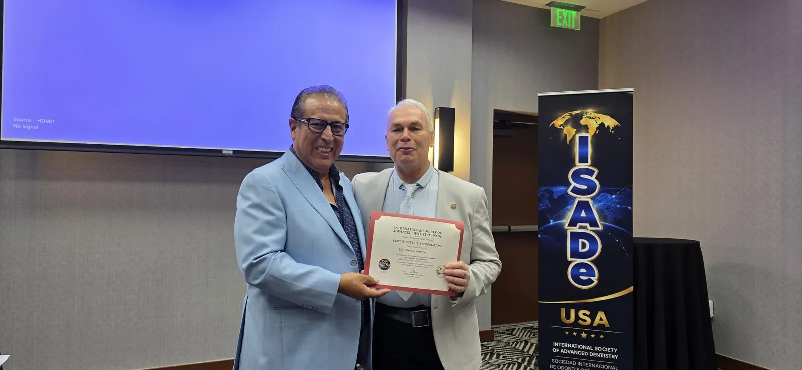 A Certificate of Appreciation being presented to a distinguished speaker.